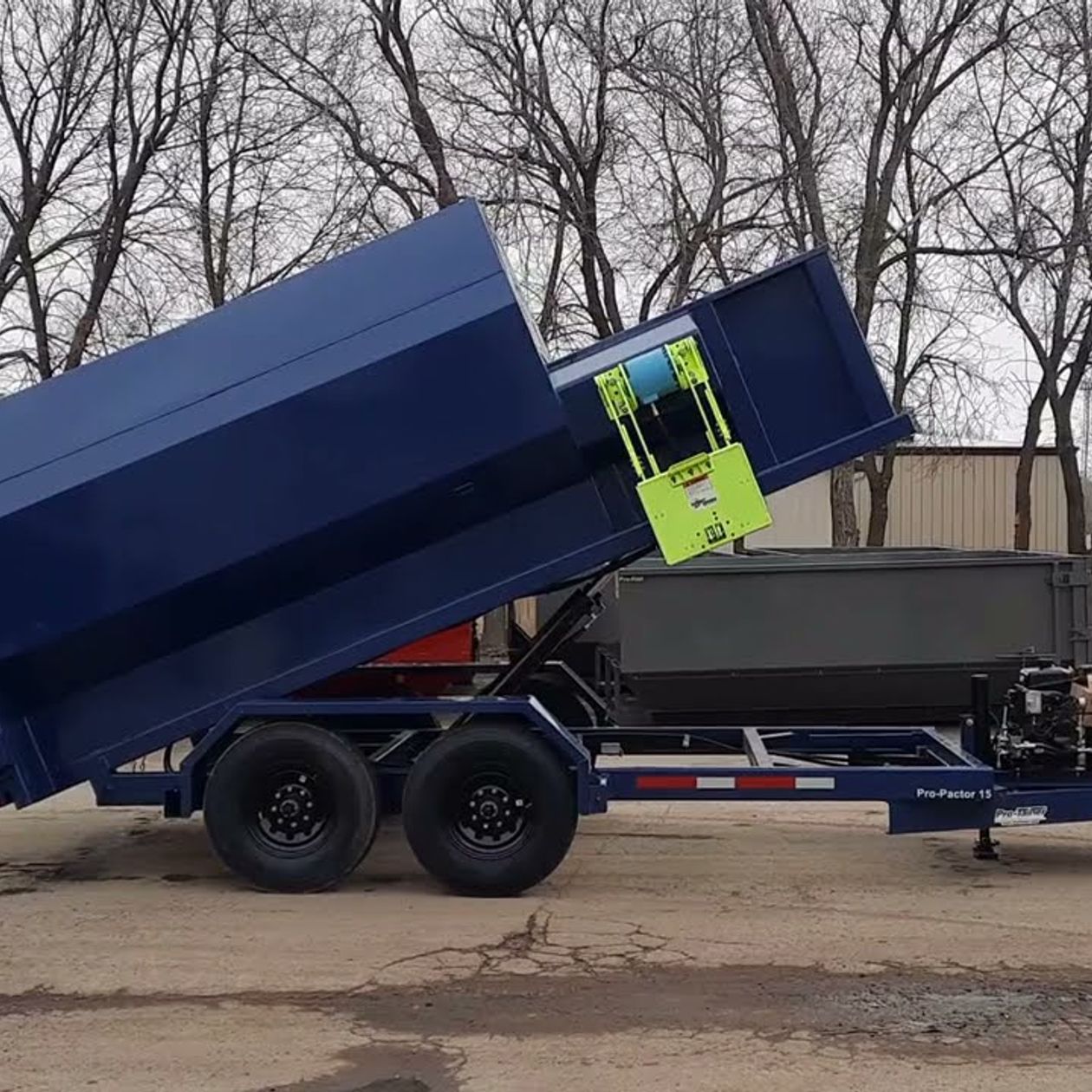 worker cleaning new wooden flooring